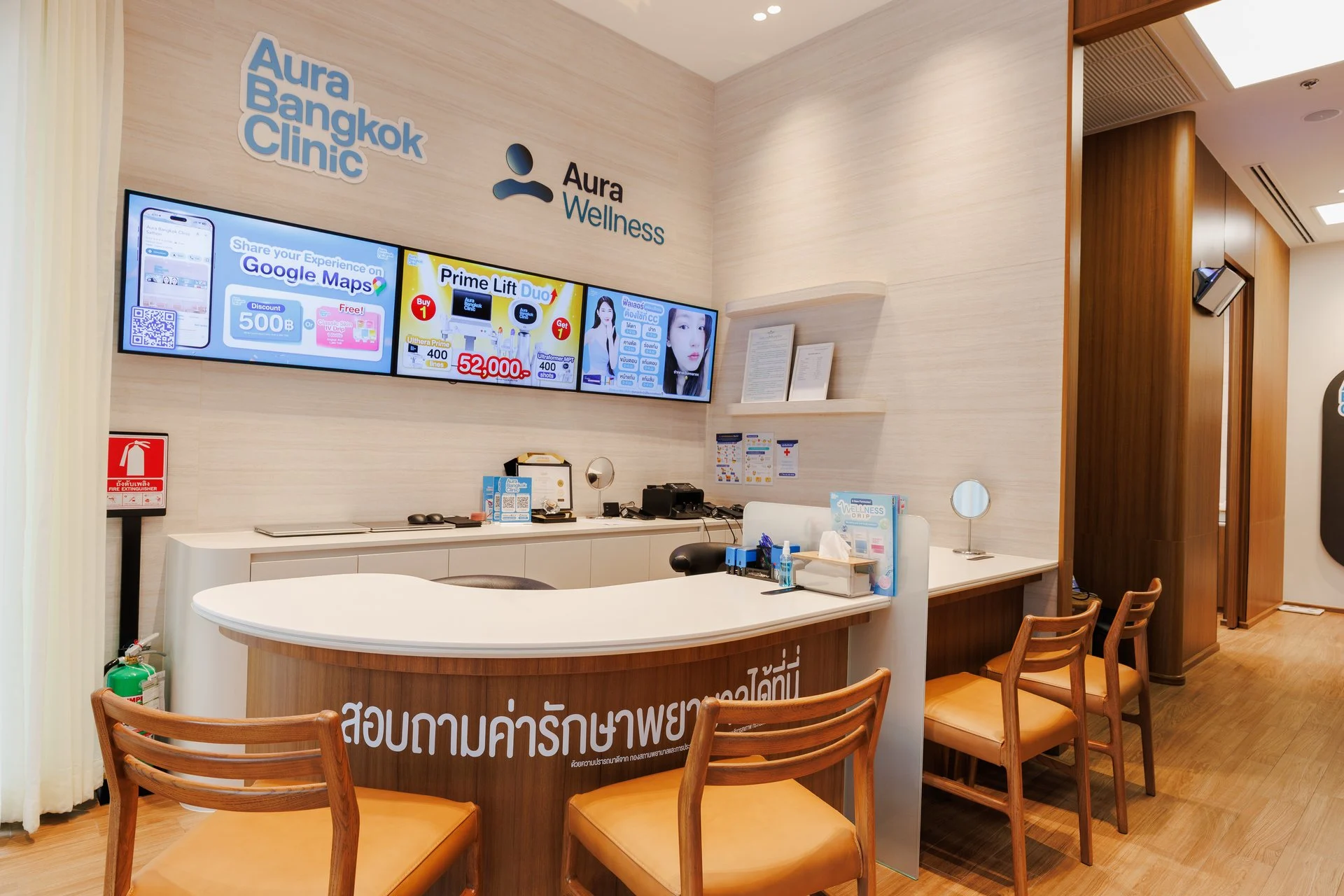 Consultation counter with treatment menus at Aura Bangkok Clinic Sathorn
