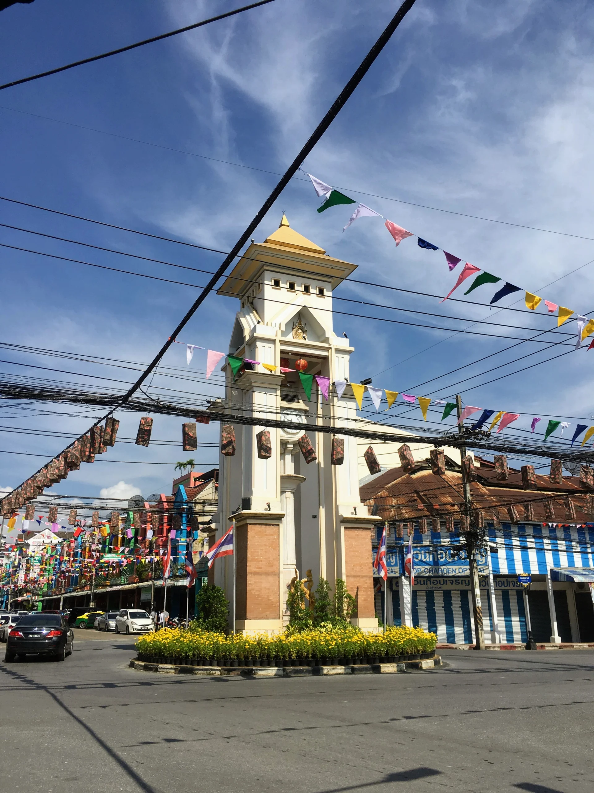 Betong clock tower decorated with flags in the town centre