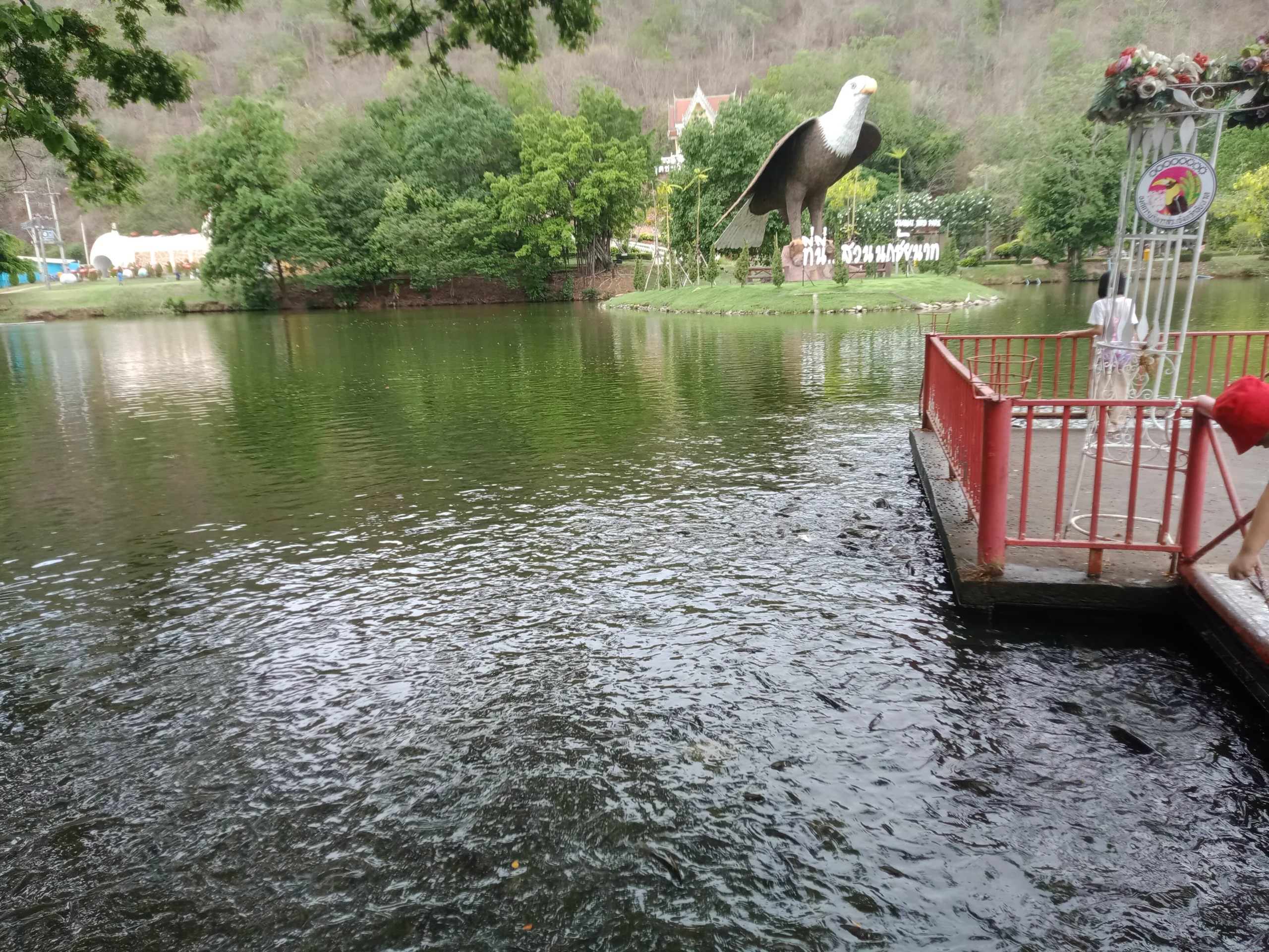 Lake and giant eagle statue at Chai Nat Bird Park