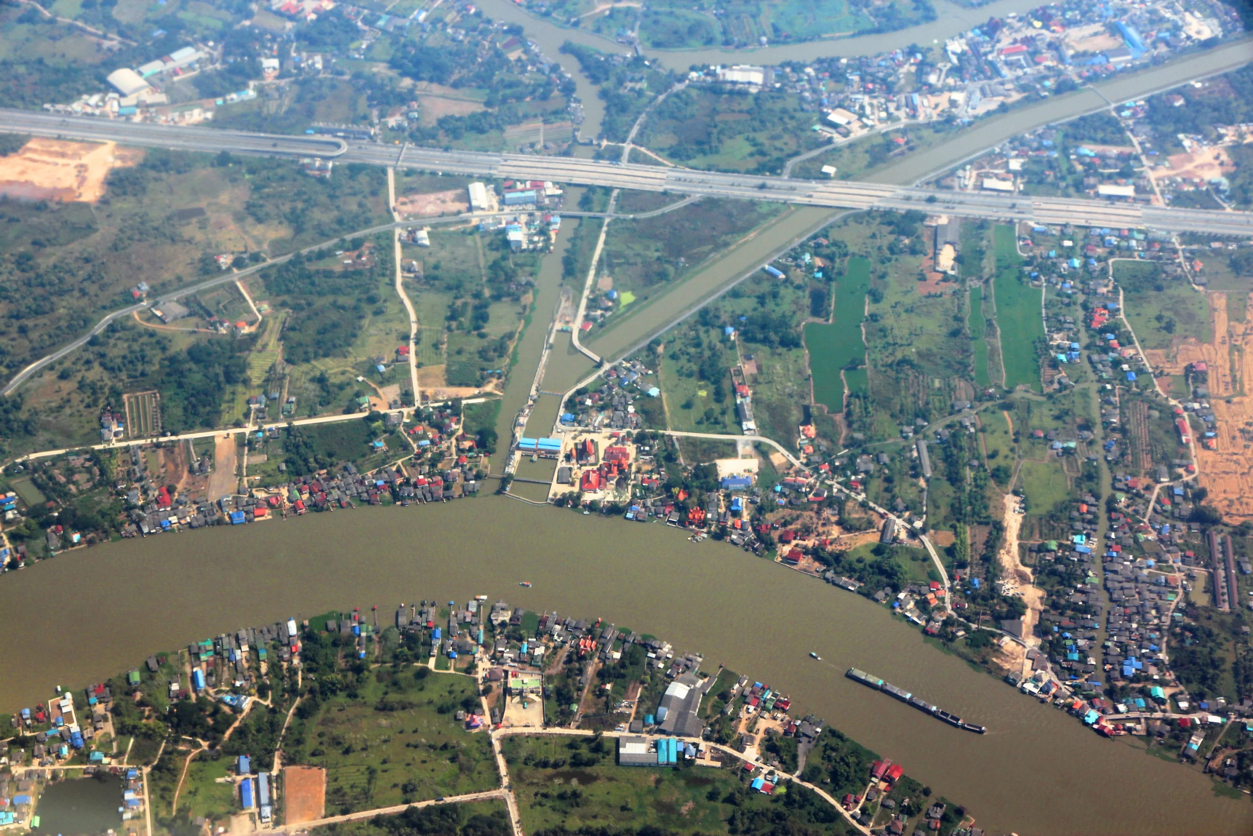 A working barge on the Chao Phraya river in Pathum Thani
