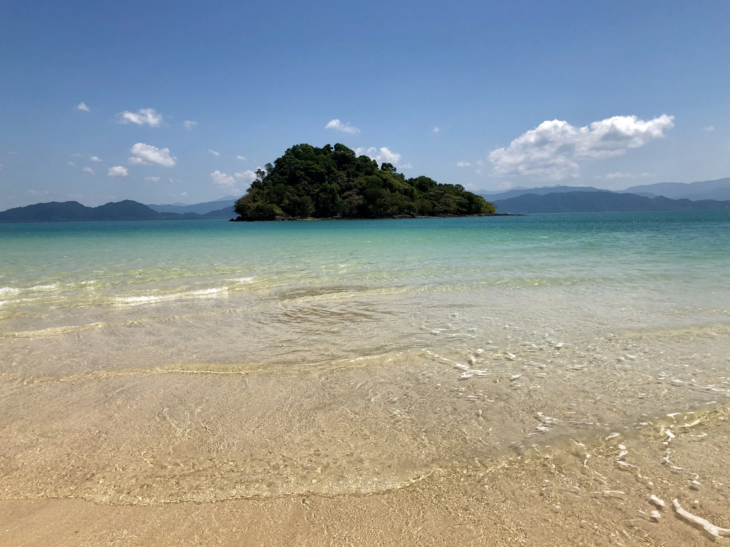 Empty white-sand beach and islet on Koh Phayam, Ranong