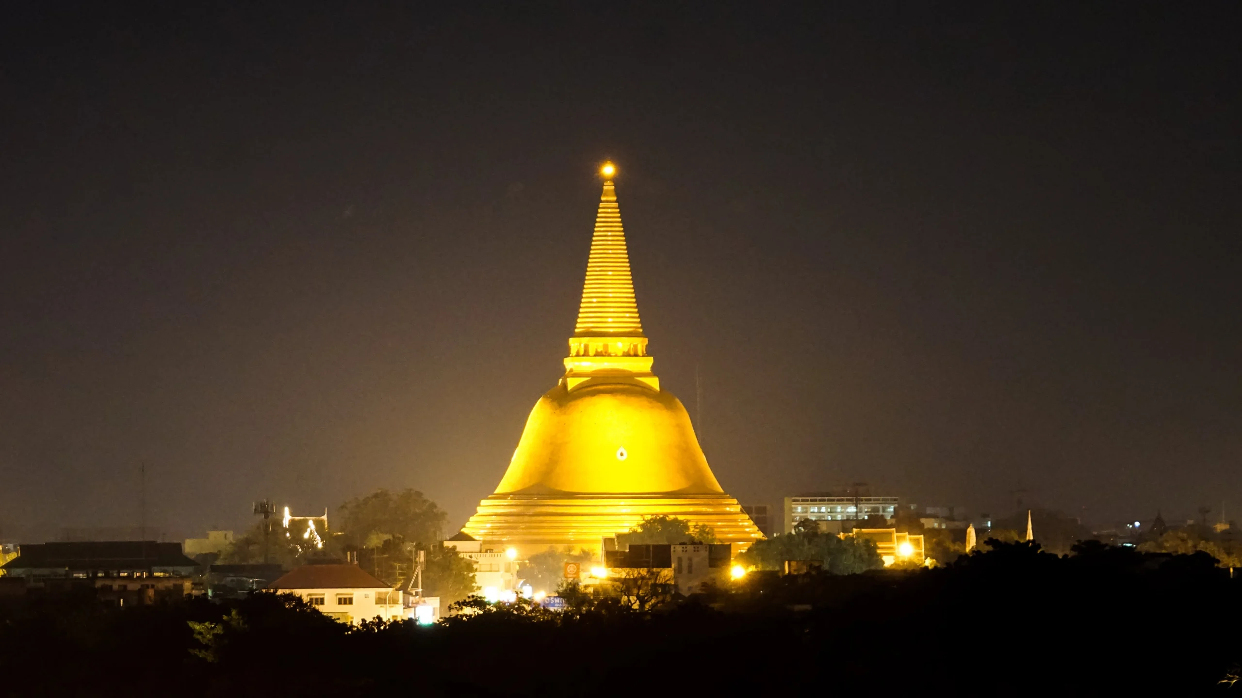 Phra Pathommachedi, the world's tallest stupa, glowing gold at night