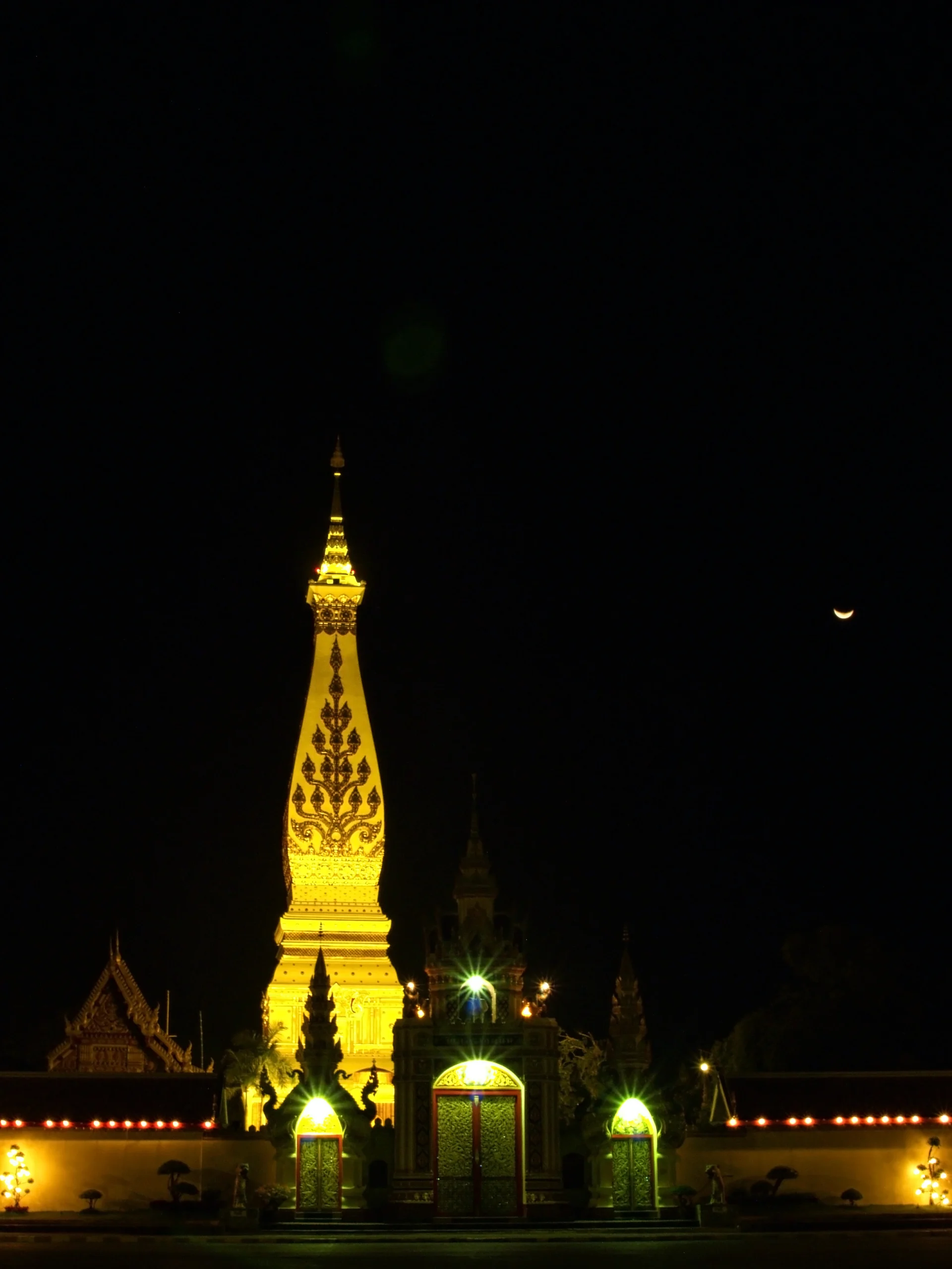 Phra That Phanom stupa lit up after dark