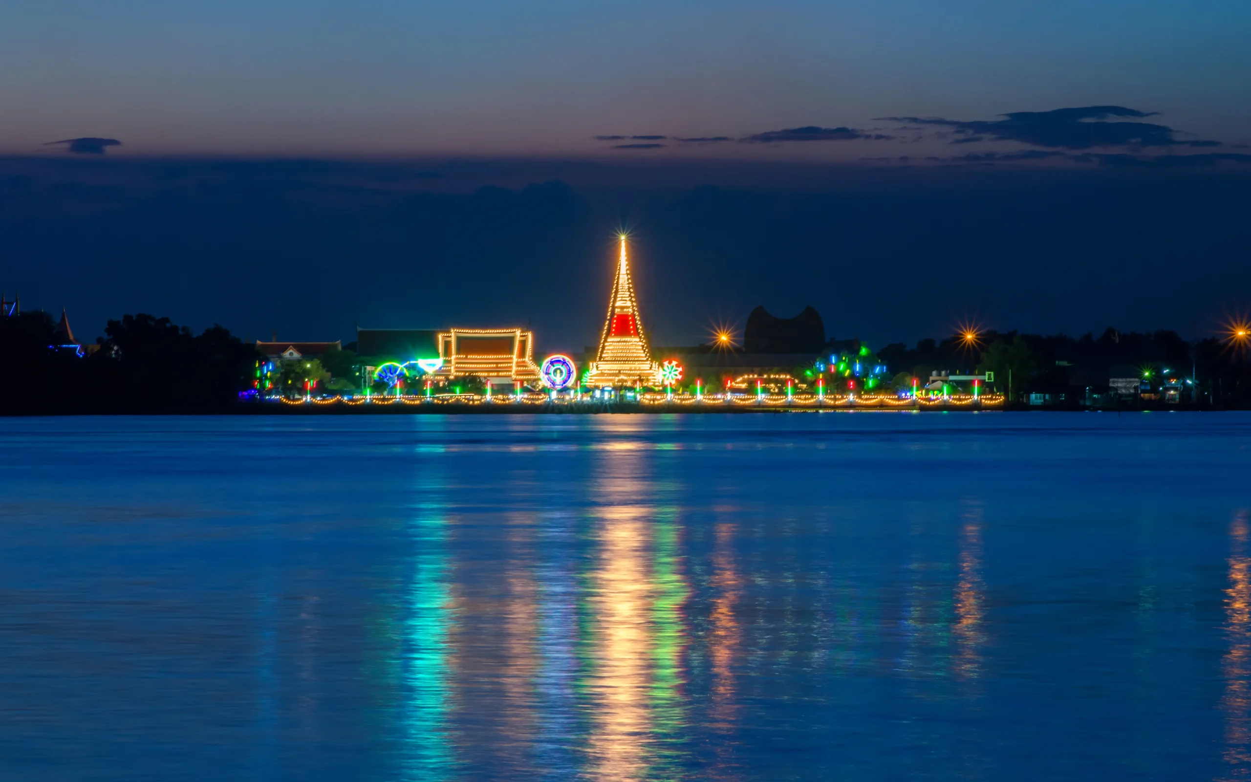 Phra Samut Chedi glowing over the river at dusk, Samut Prakan