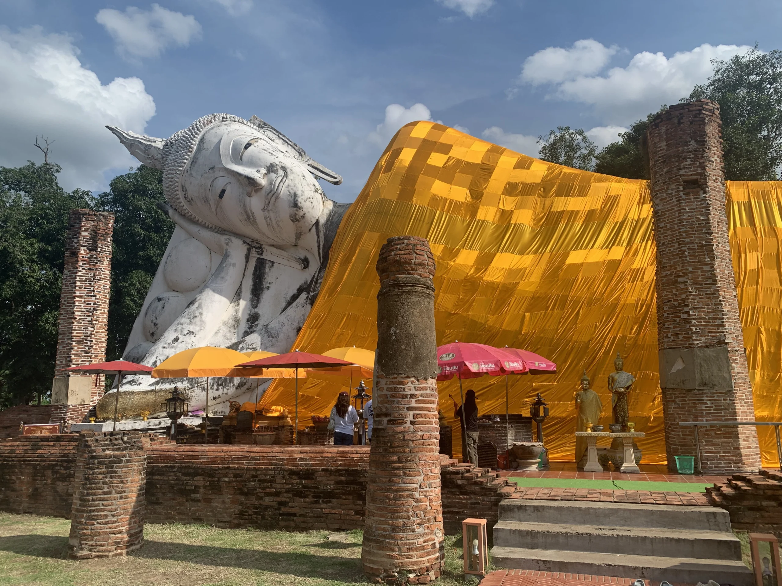 The outdoor reclining Buddha of Wat Khun Inthapramun under its yellow robe, Ang Thong