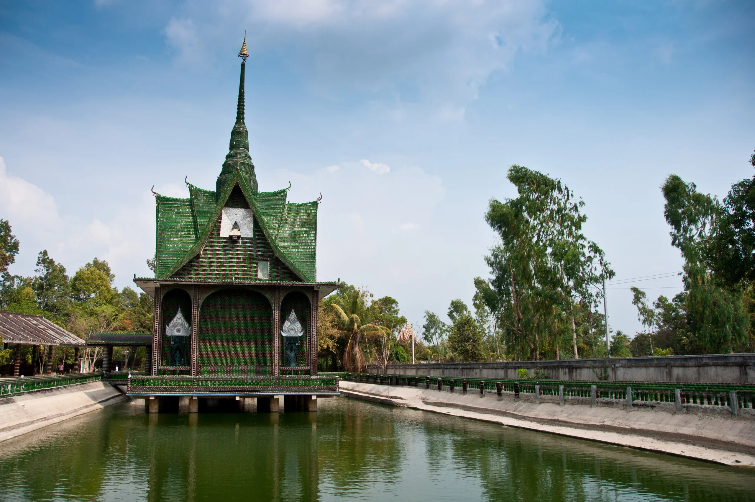 Wat Lan Khuat, the million bottle temple of Si Sa Ket, reflected in its pond
