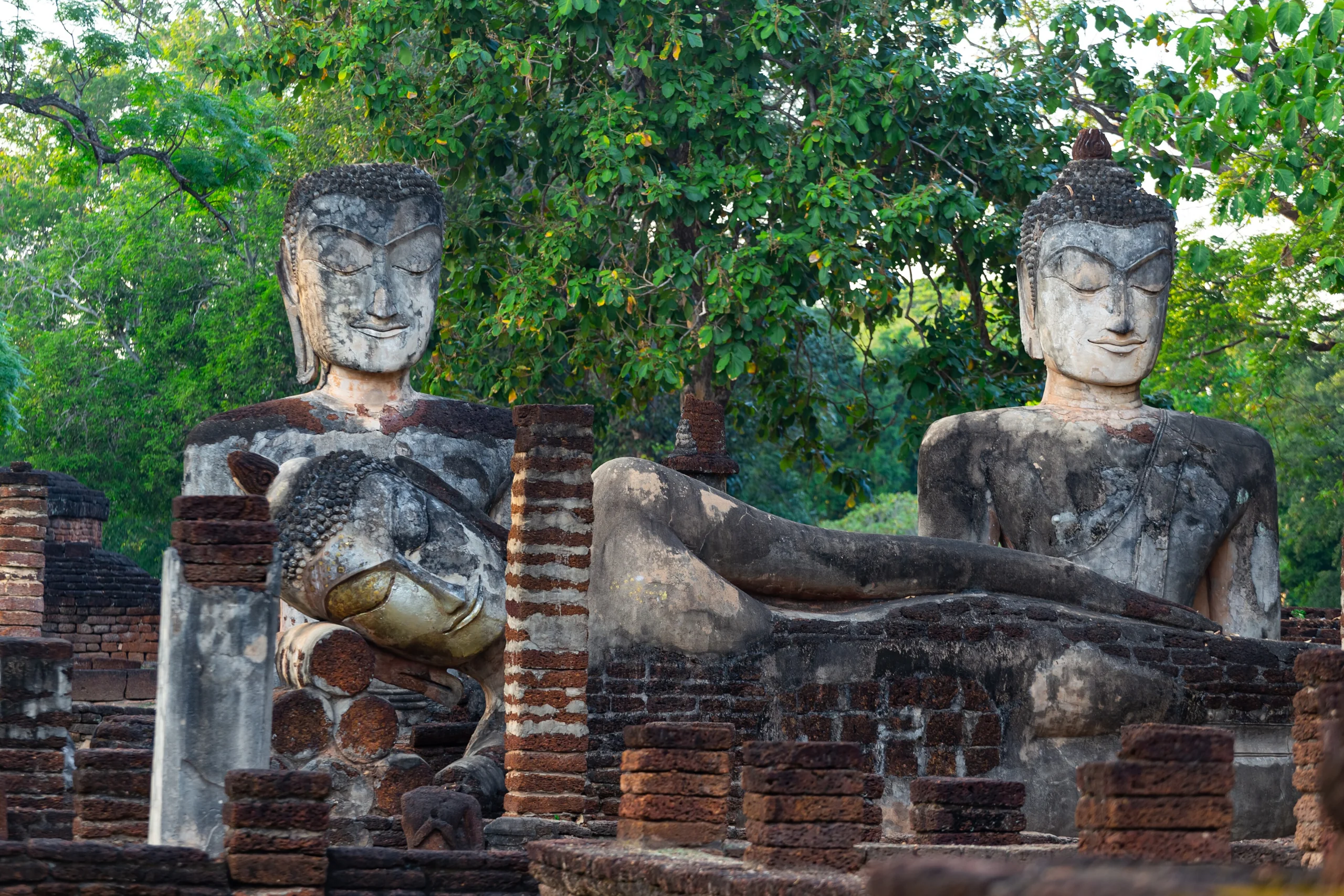 Weathered Buddha images at Wat Phra Kaeo in Kamphaeng Phet Historical Park