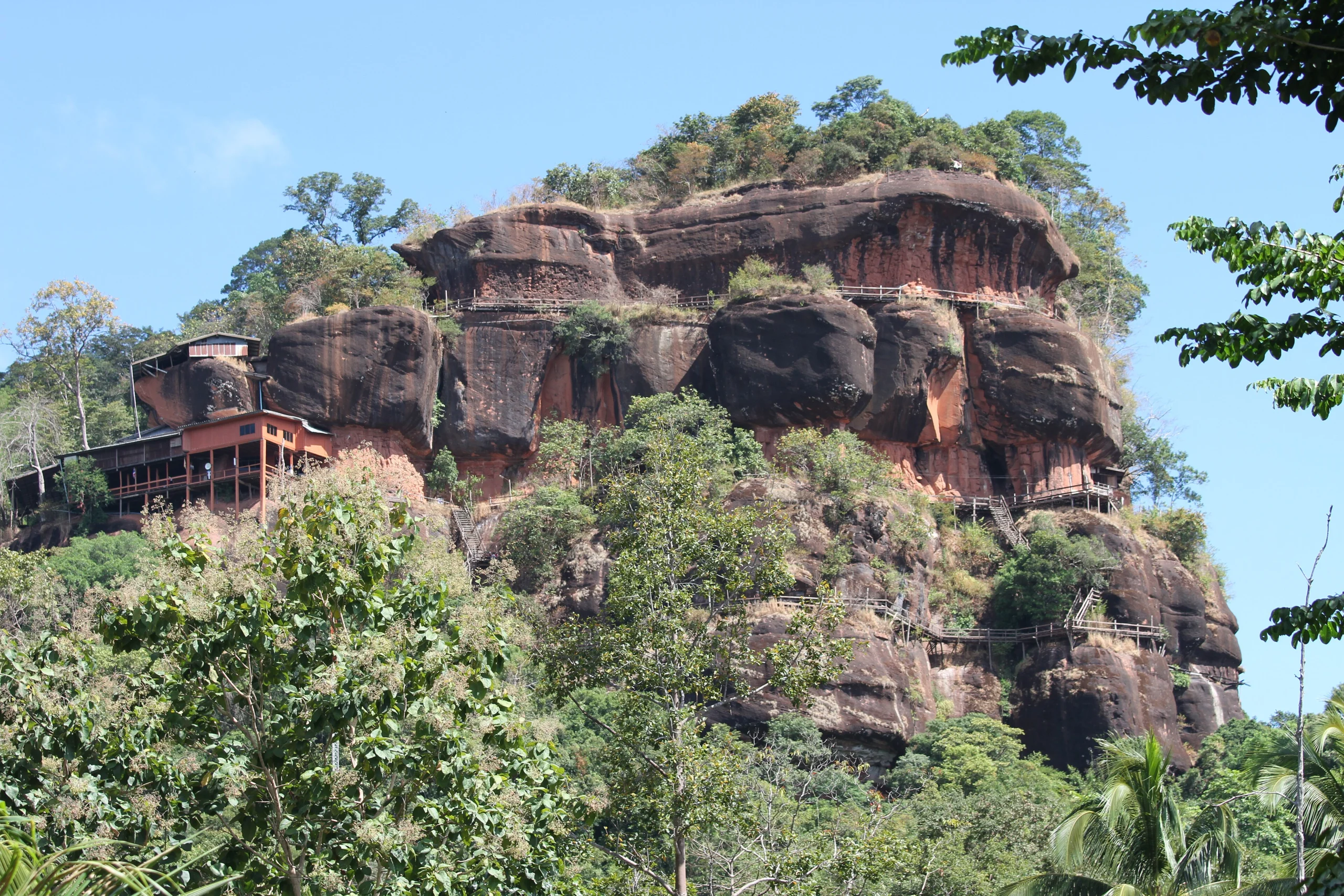 The sandstone mountain of Wat Phu Tok rising from the plain, Bueng Kan