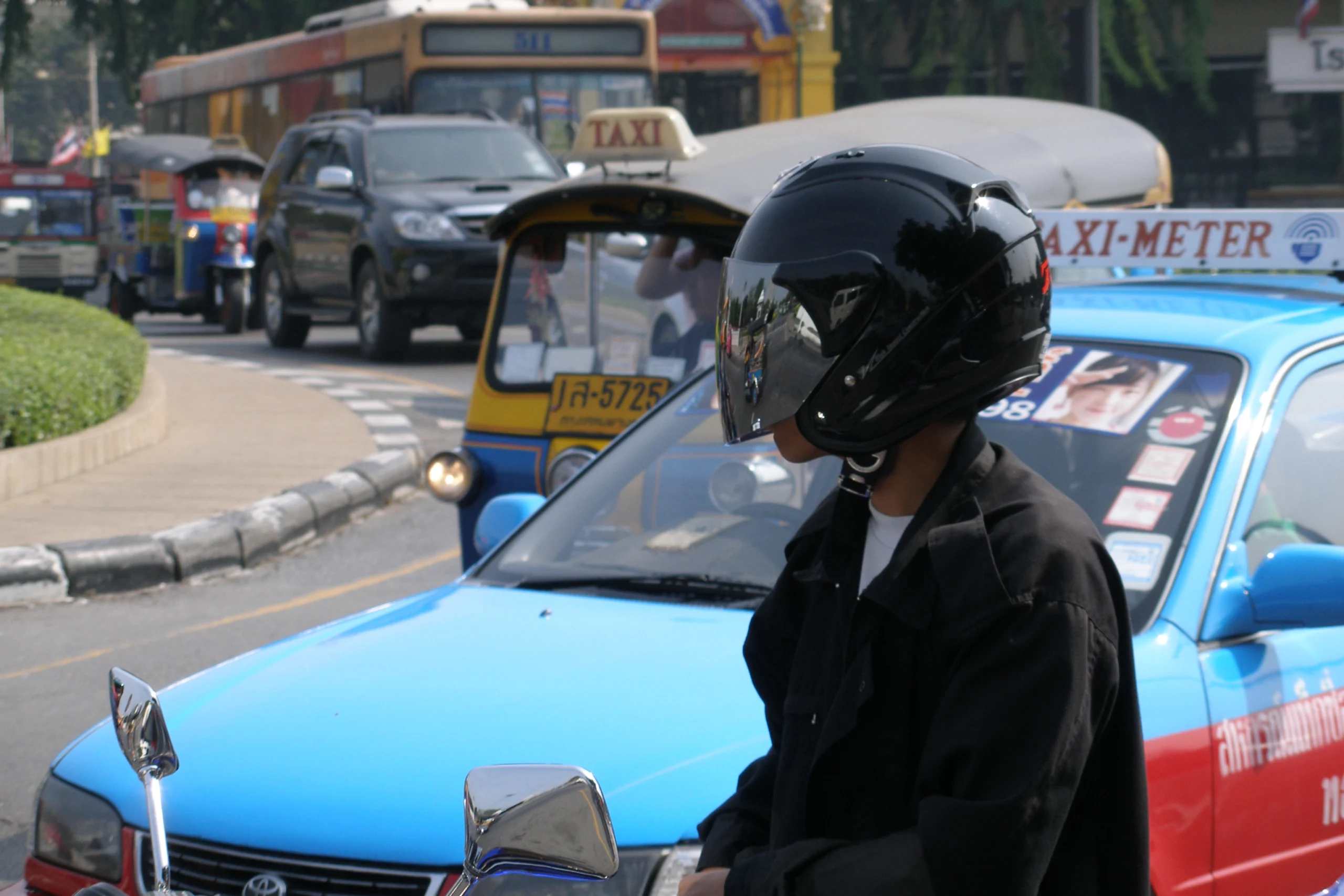 Bangkok's two-wheeled traffic — rent the scooter, wear the helmet