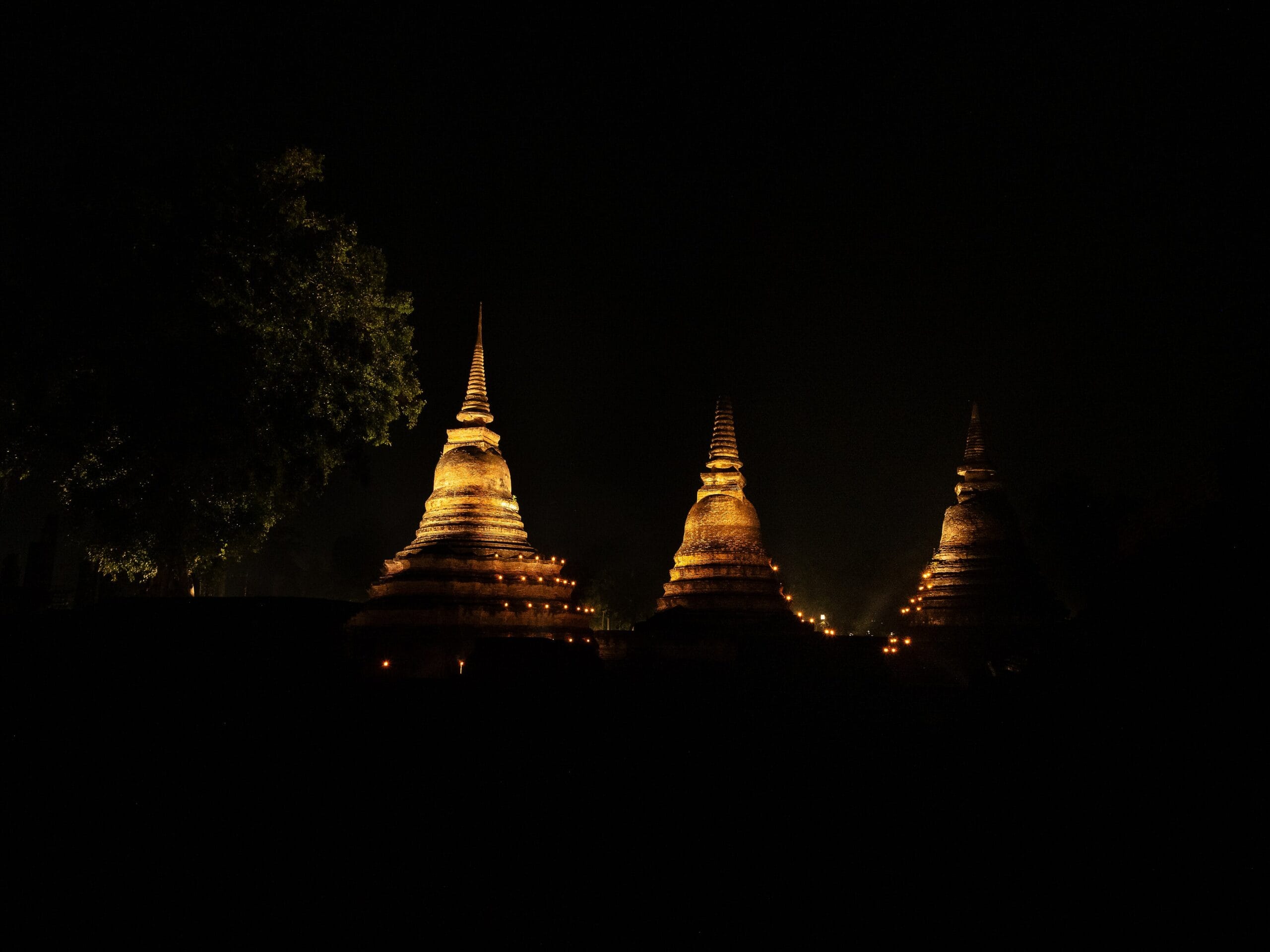 Sukhothai ruins lit from below during the Loy Krathong festival
