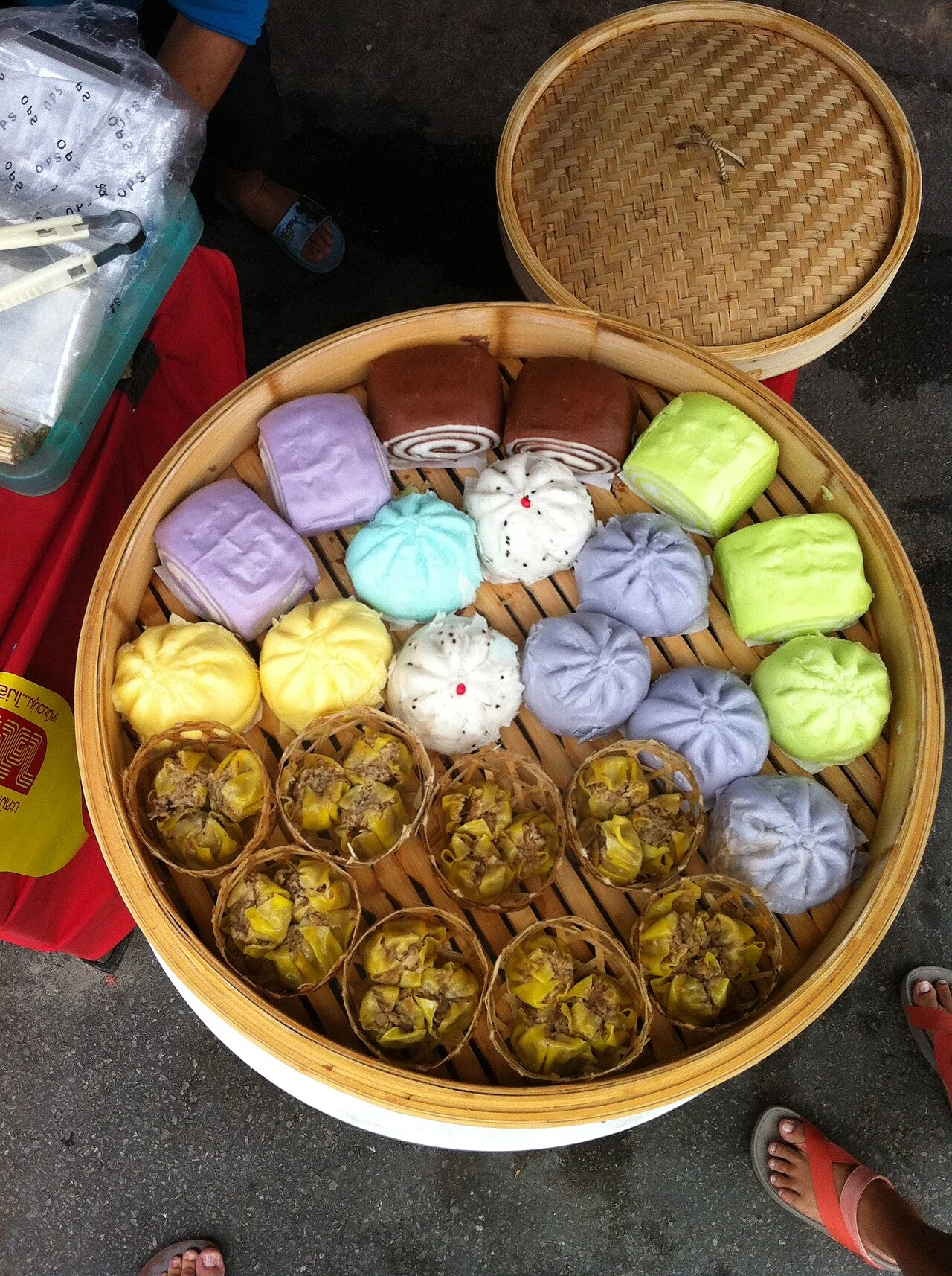 Bamboo steamer of colourful jay steamed buns and dumplings at the Phuket Vegetarian Festival
