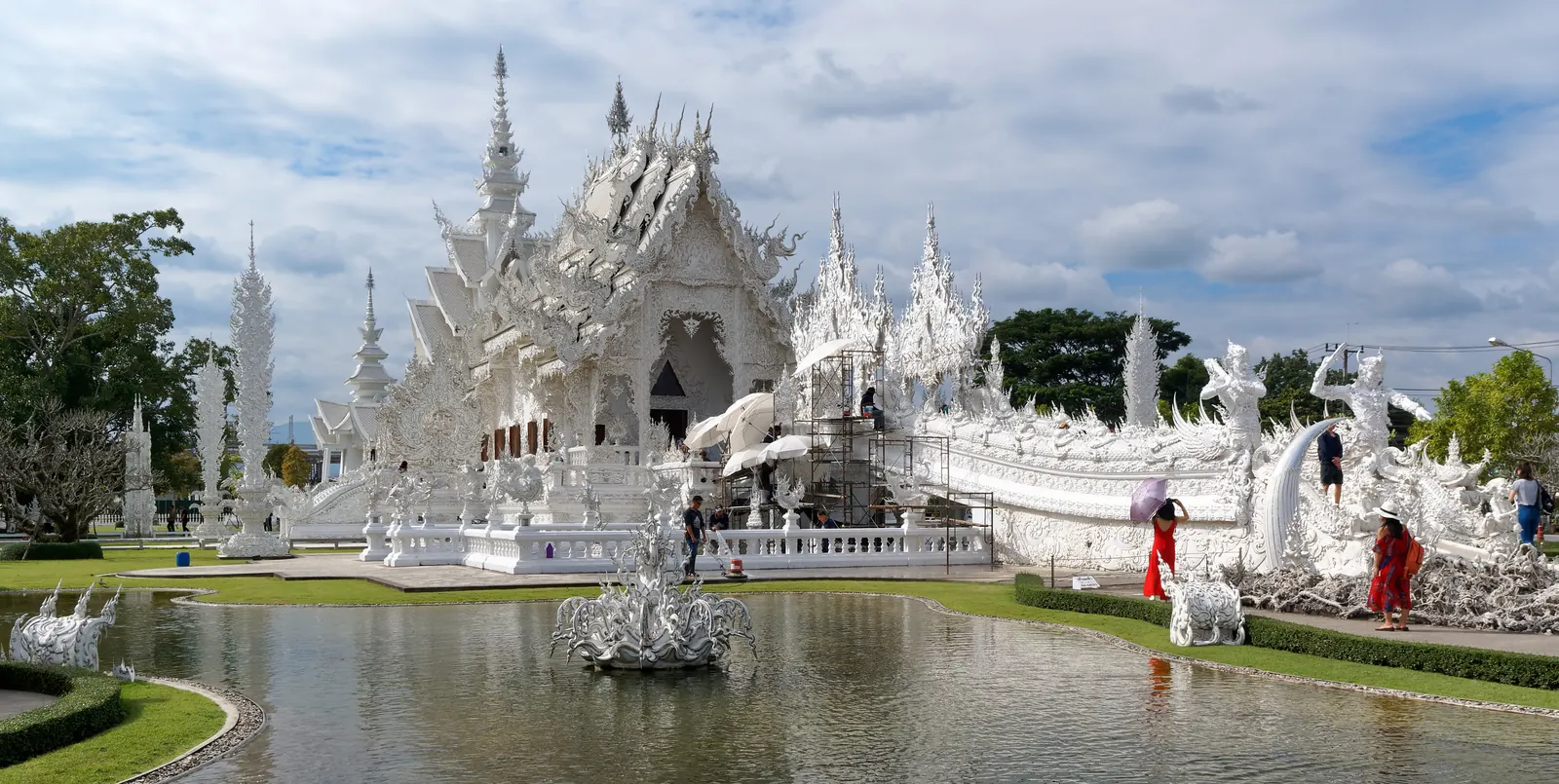 Wat Rong Khun, the White Temple in Chiang Rai, with its bridge and reflecting pond
