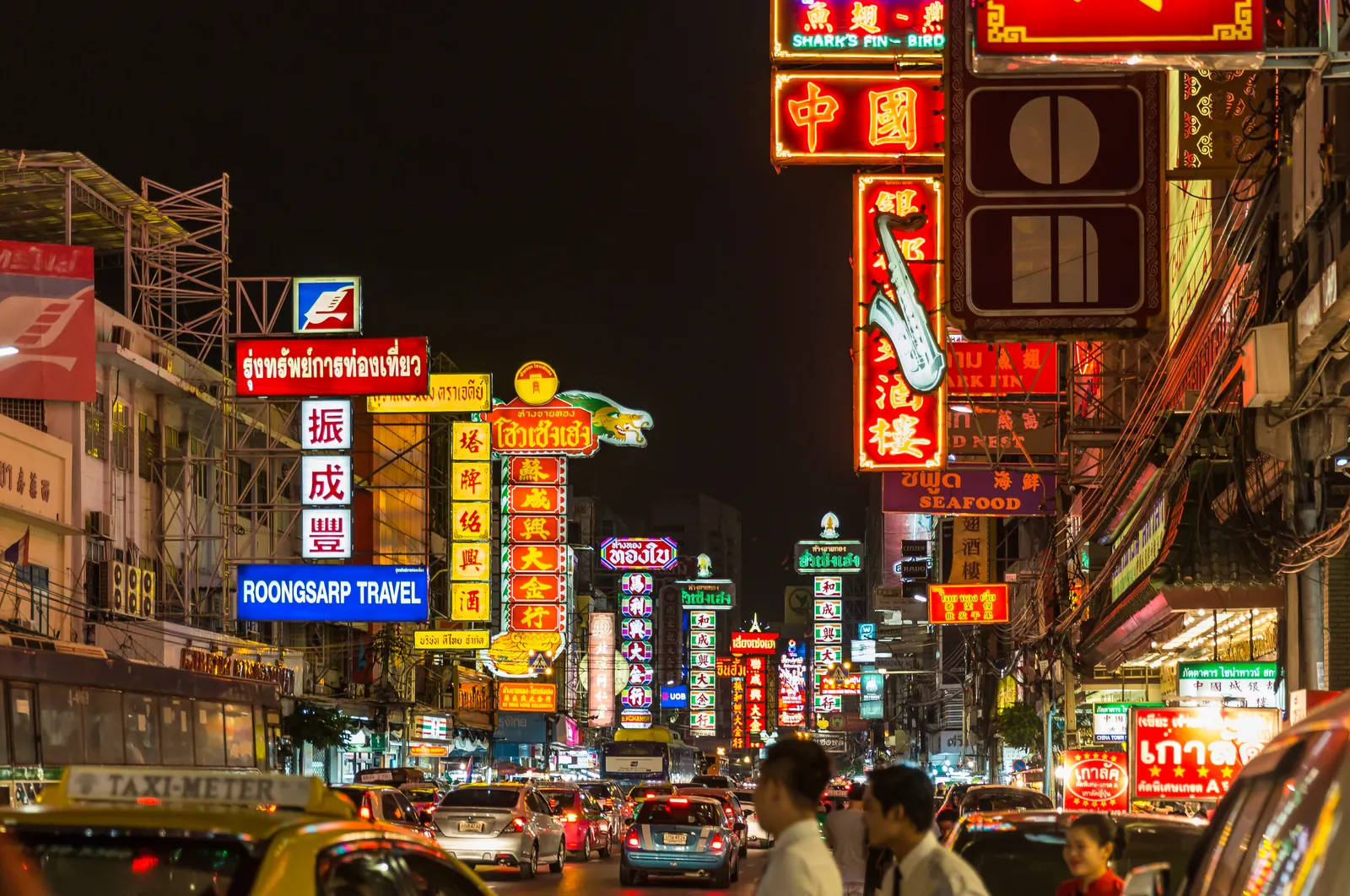 Neon signs and traffic on Yaowarat Road, Bangkok's Chinatown, at night