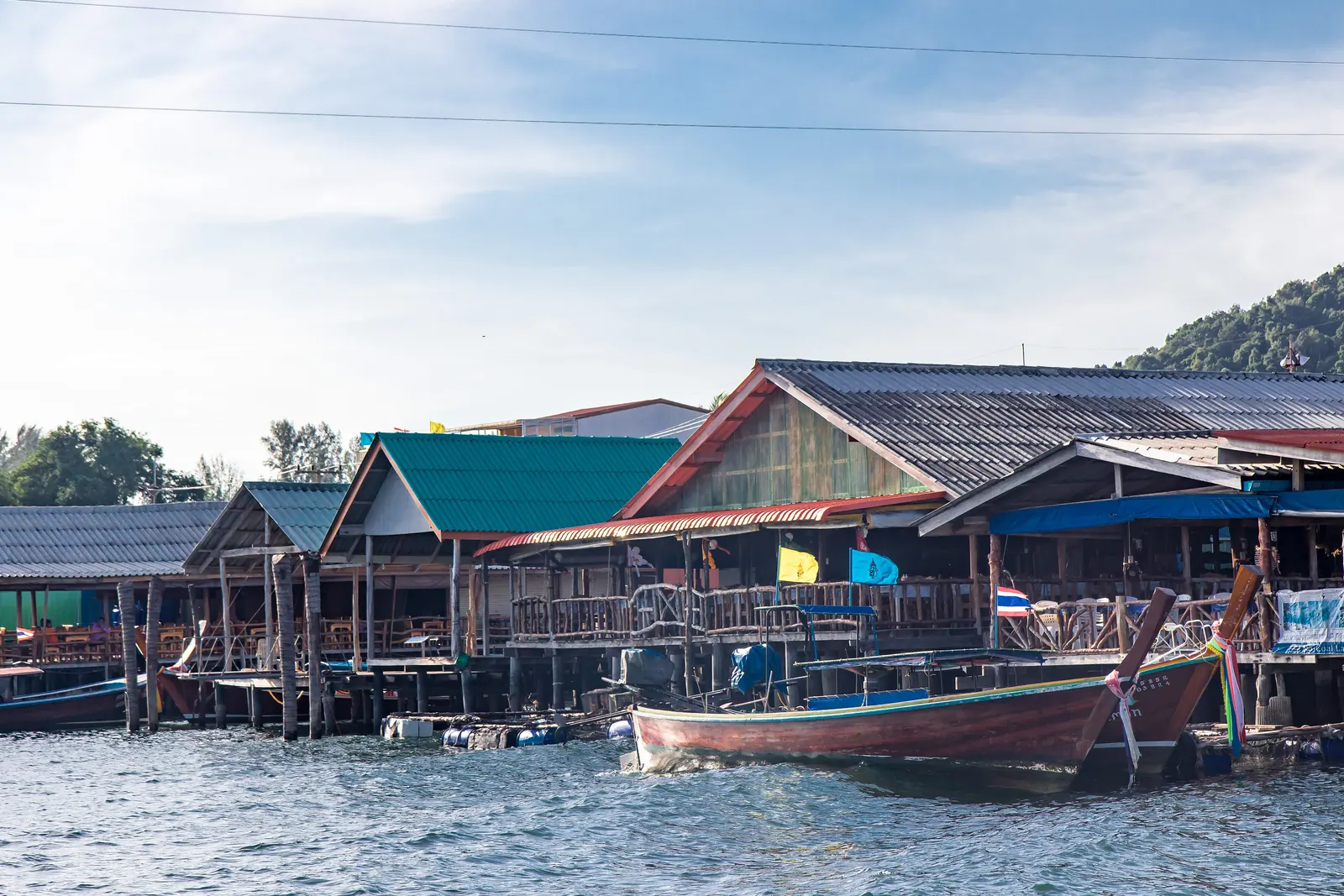 Saladan pier on Koh Lanta with longtail boats and ferries, the arrival point for boats to Koh Lanta