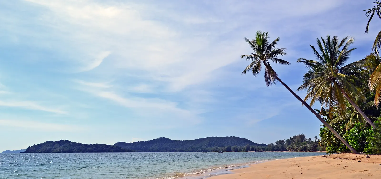 Ao Kao beach on Koh Mak, Trat, with resort bungalows under coconut palms