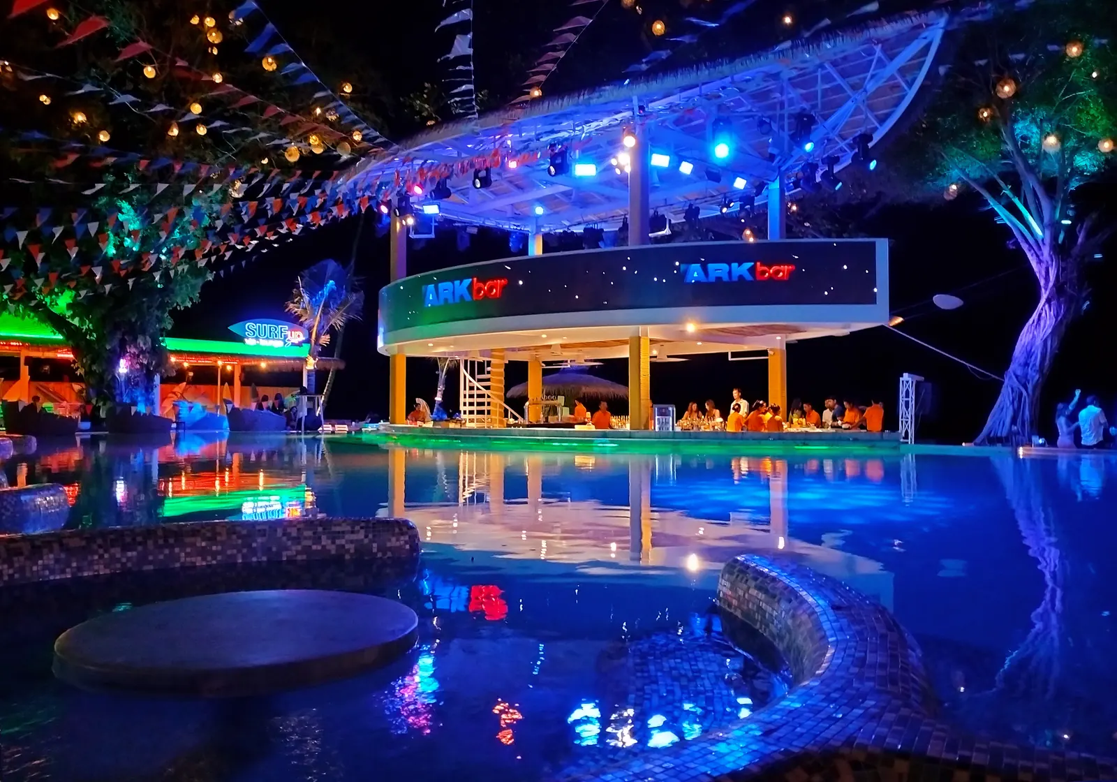 Beach club pool lit up at night on Chaweng Beach, Koh Samui