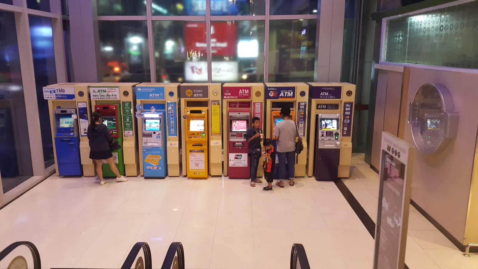 Row of Thai bank ATMs inside a Bangkok shopping mall