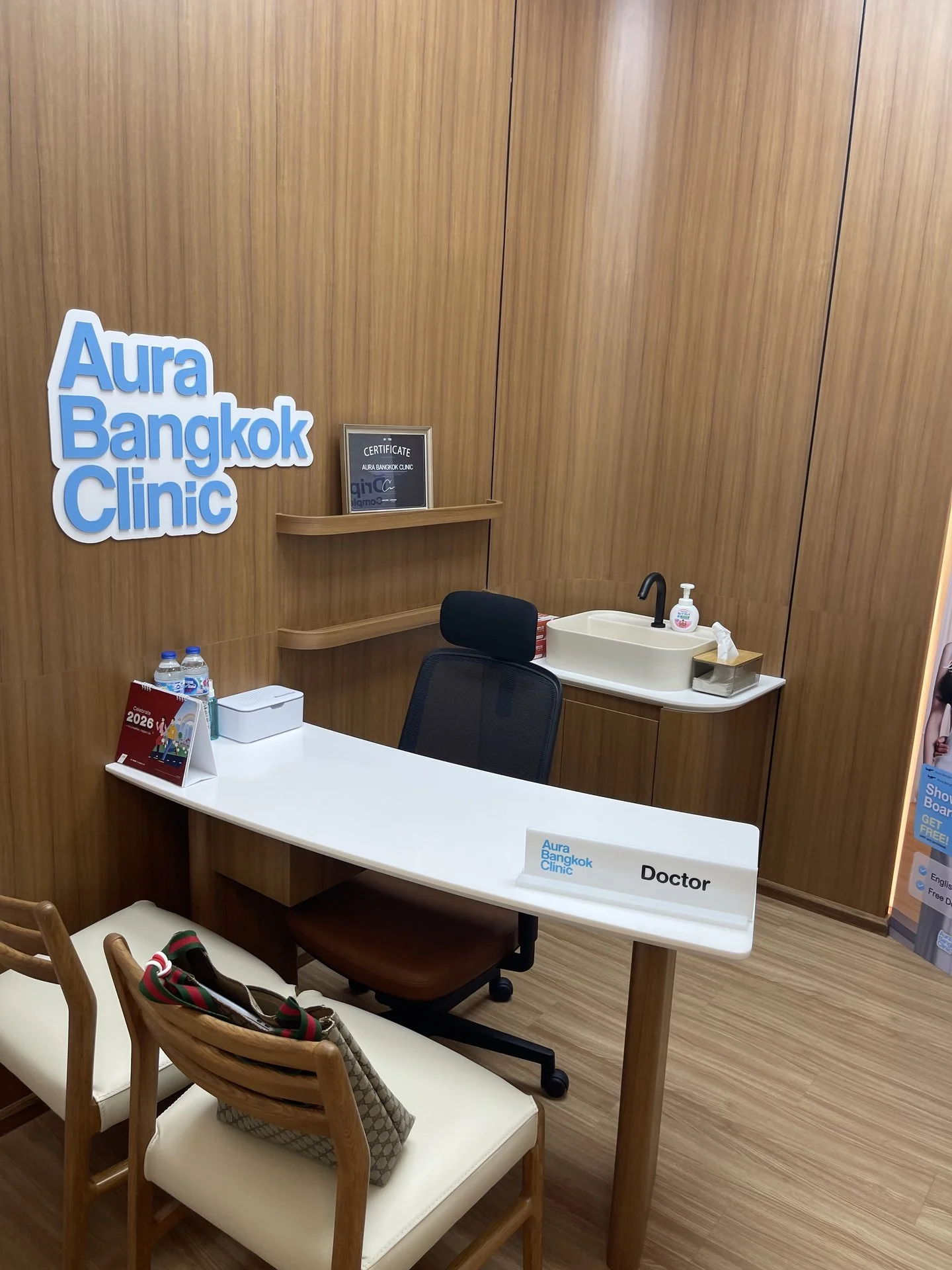 Doctor consultation desk in a private room at Aura Bangkok Clinic Suvarnabhumi Airport branch