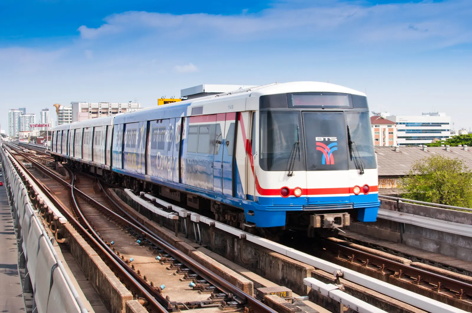 A BTS Skytrain arriving at On Nut station on the Sukhumvit Line, Bangkok