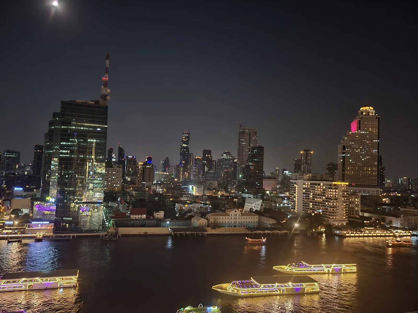 The Chao Phraya River and the Bang Rak skyline at night, seen from ICONSIAM