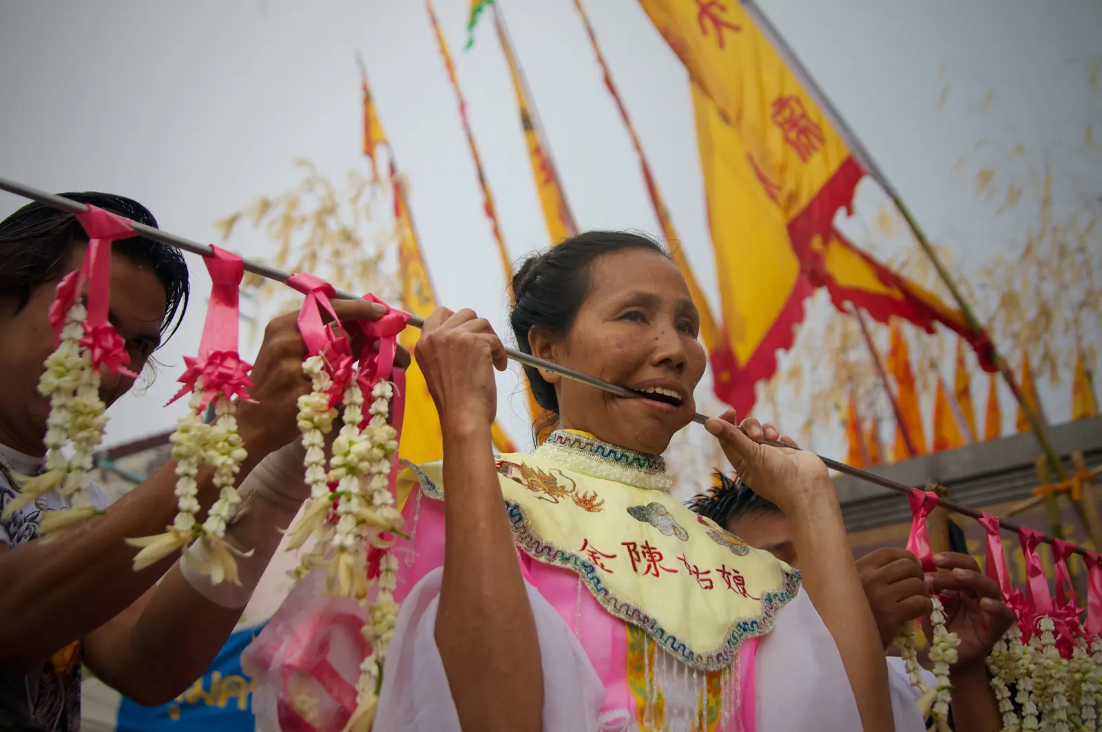 Ma song spirit medium with pierced cheeks in a Phuket Vegetarian Festival 2026 street procession