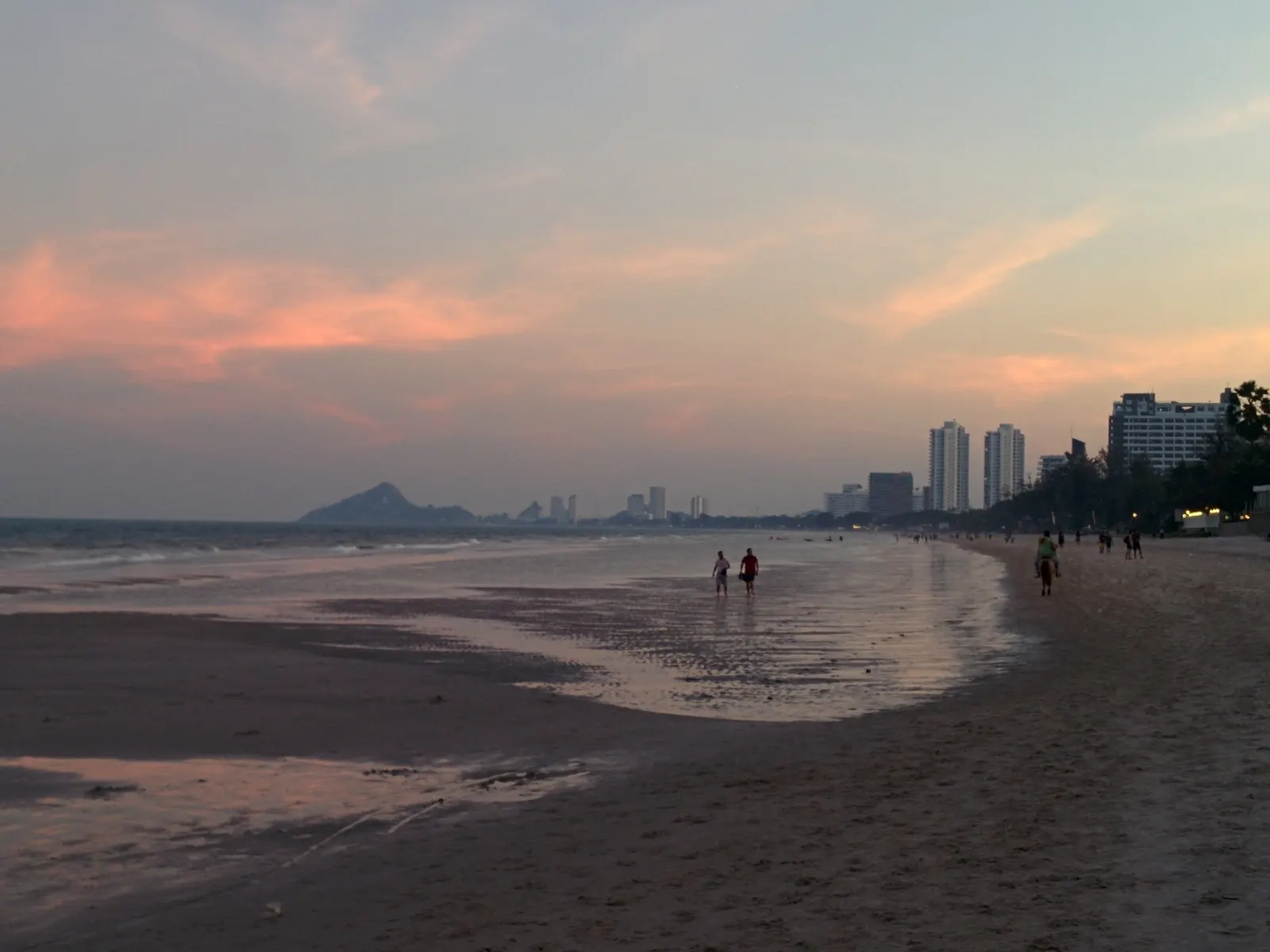 Hua Hin Beach in the evening with Khao Takiab in the distance