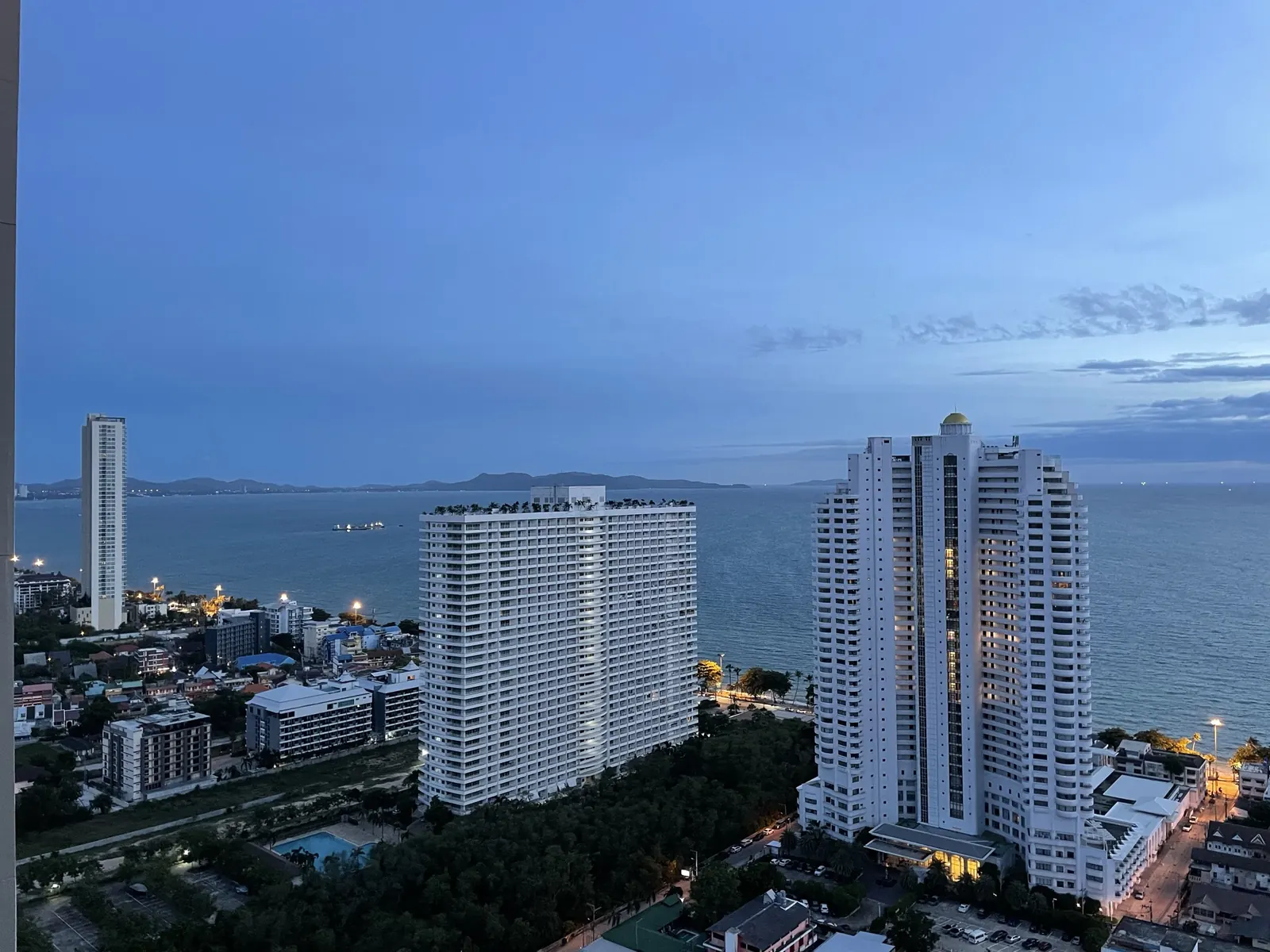 Jomtien's coastline and beachfront towers at dusk, Pattaya
