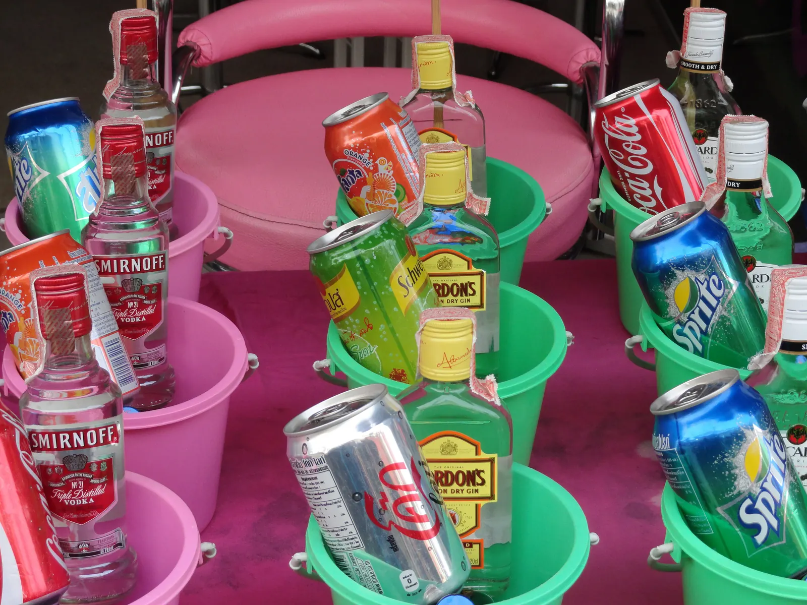 Buckets of spirits and mixers for sale at the Full Moon Party, Haad Rin, Koh Phangan