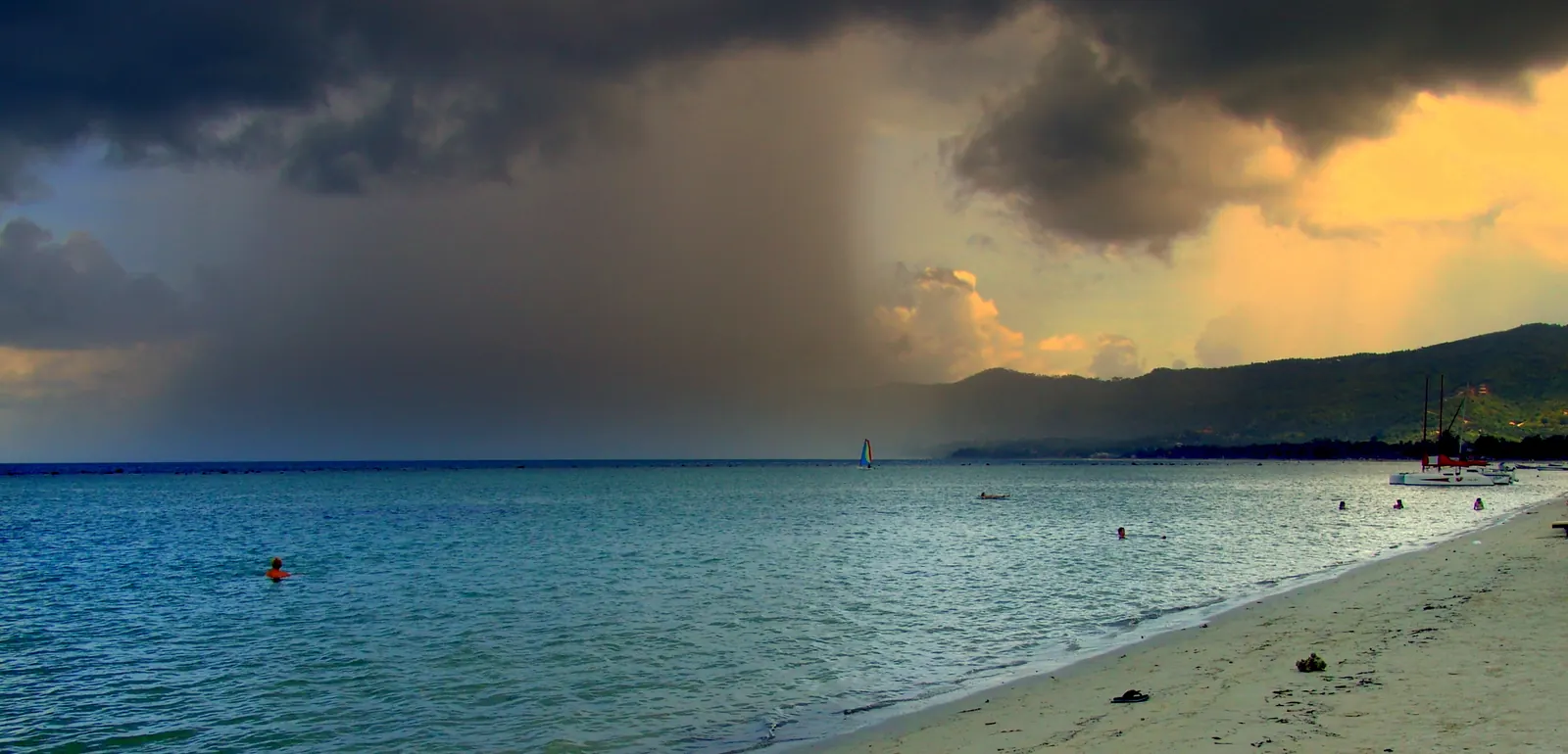 Storm clouds and a rain curtain moving over a Koh Samui beach