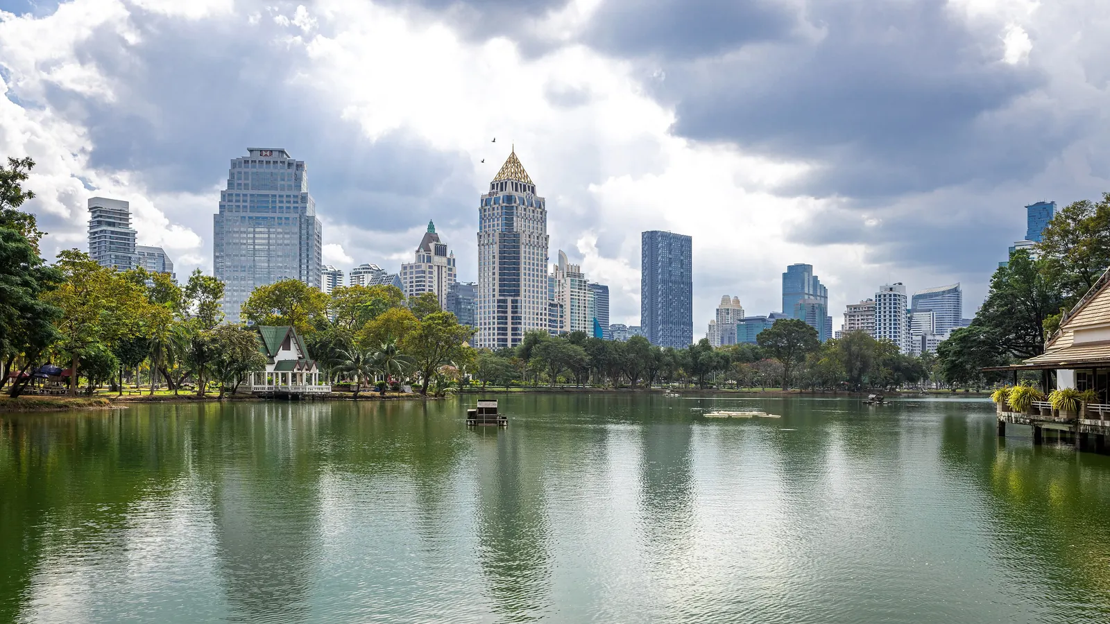 Lumphini Park in Bangkok with the Sathorn skyline behind it