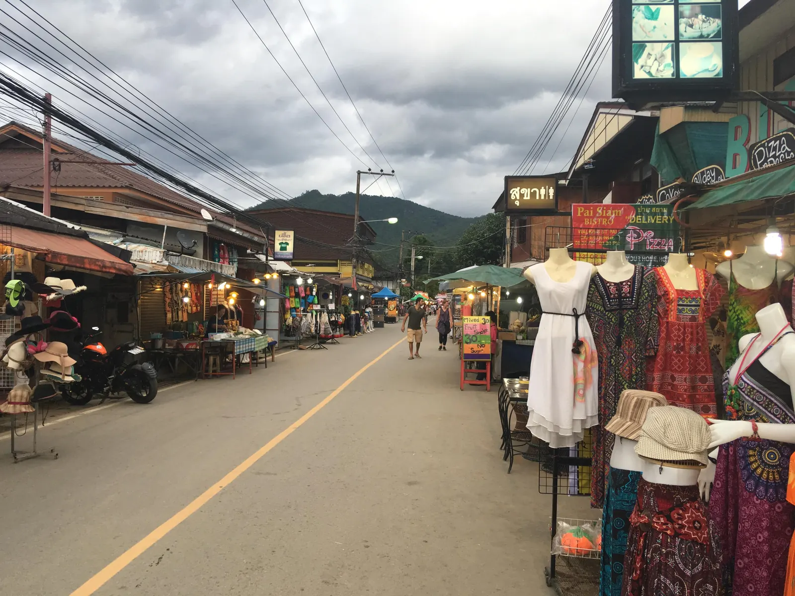 Pai Walking Street at night with food stalls and visitors
