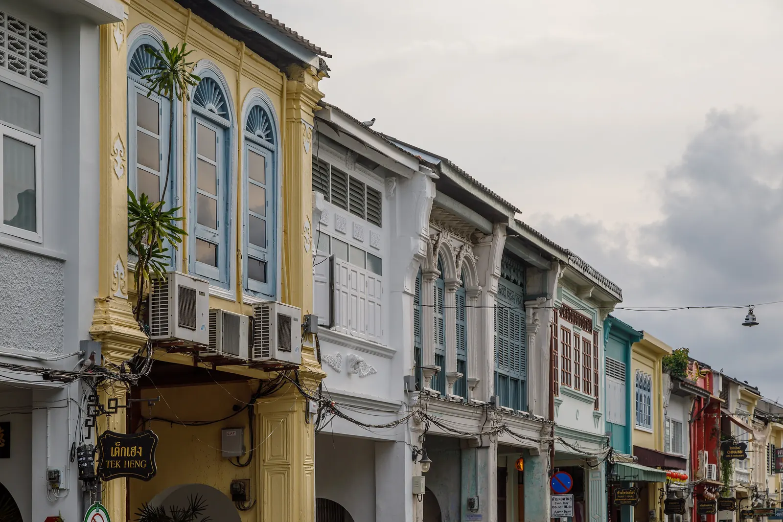 Restored Sino-Portuguese shophouses along Thalang Road in Phuket Old Town in daylight