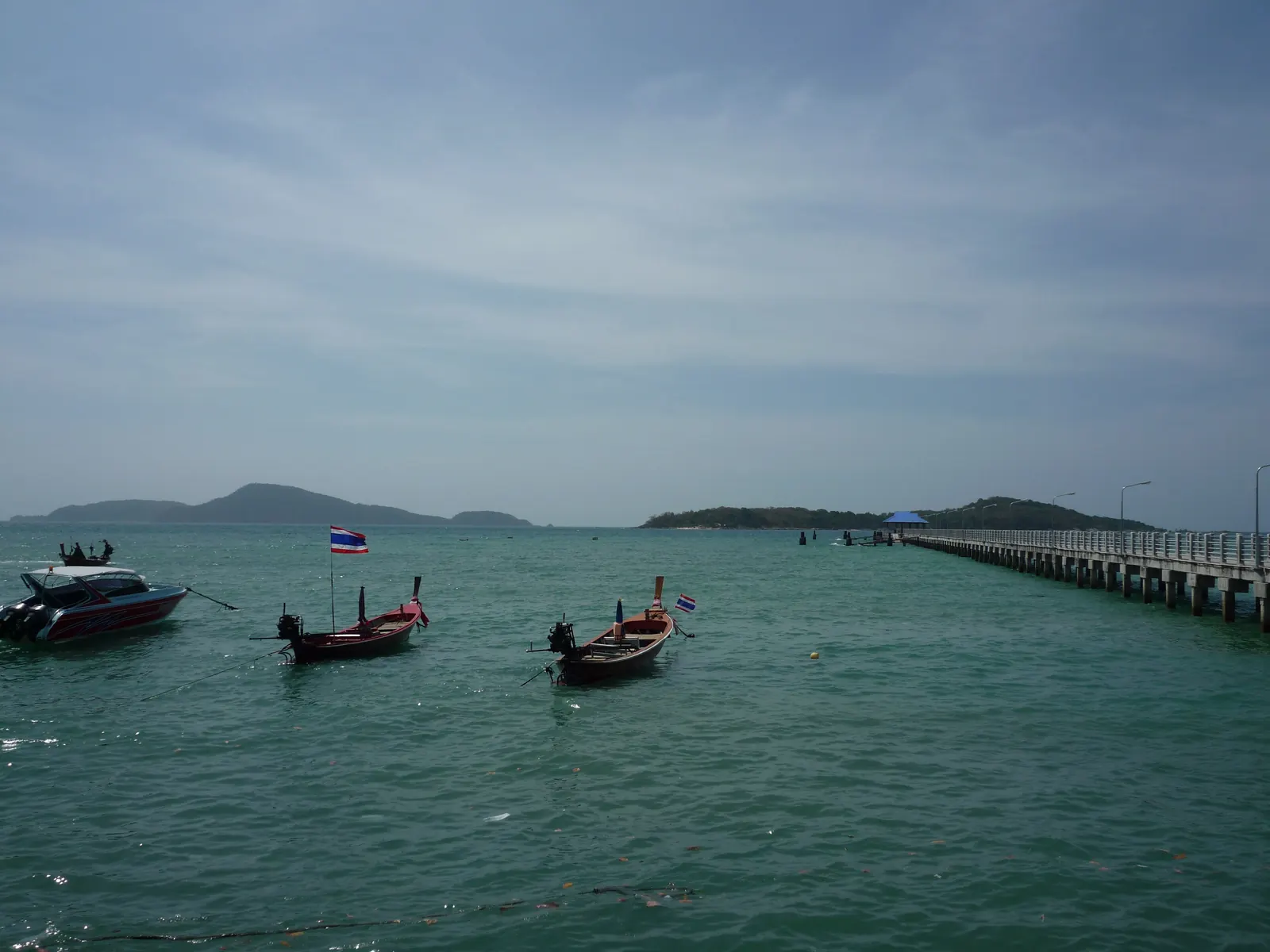Longtail boats moored off Rawai beach at the southern tip of Phuket, beside the seafood market