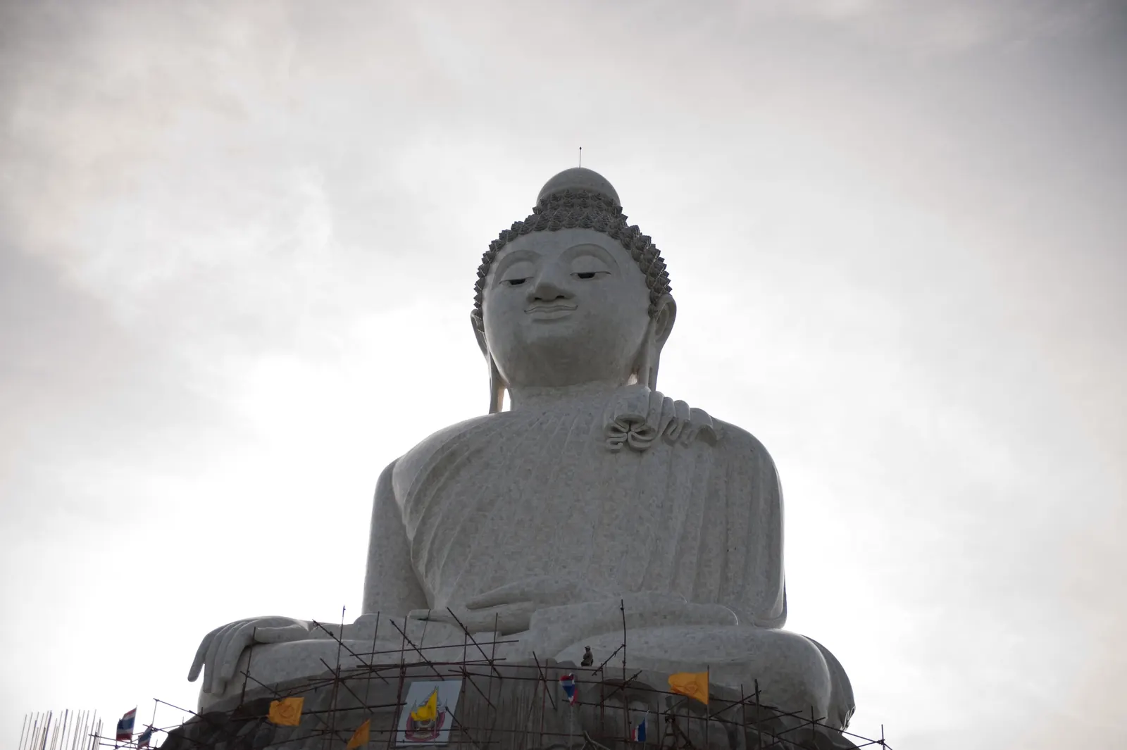 The Big Buddha of Phuket under a grey overcast sky on Nakkerd Hill