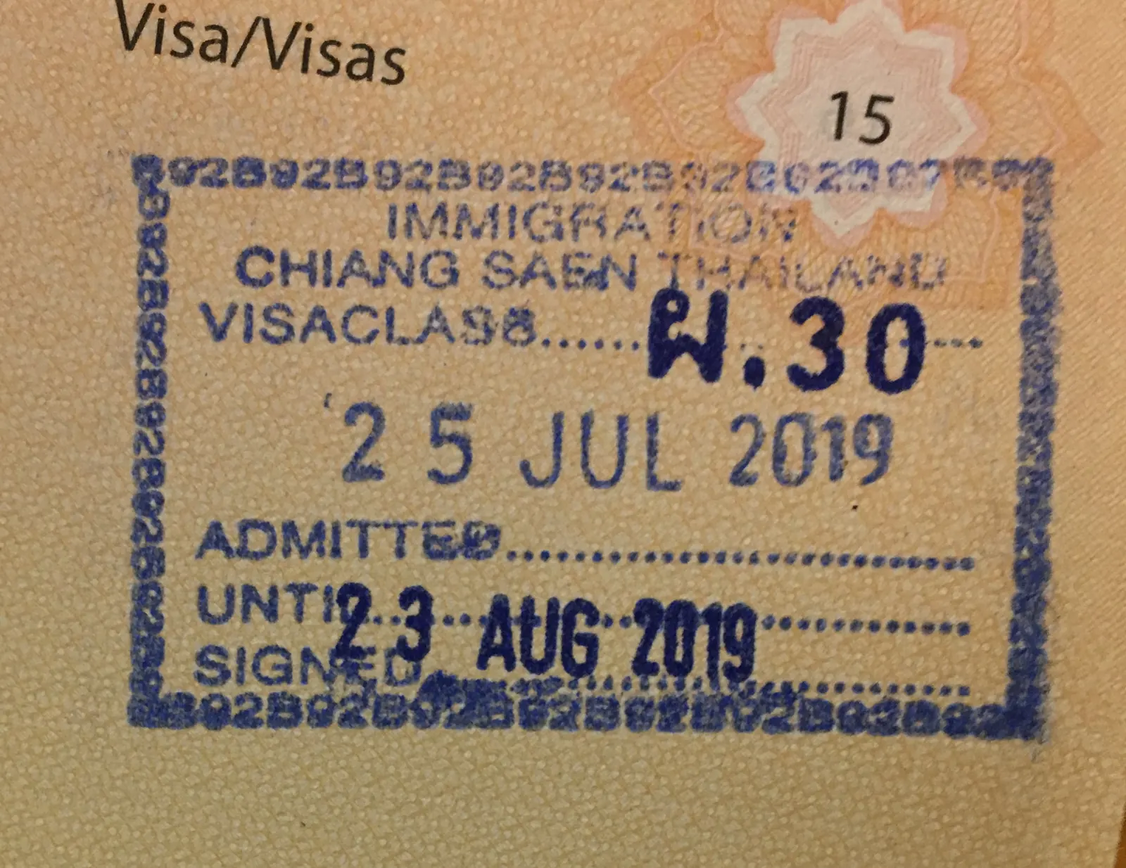 Thailand entry stamp in a passport showing the 'admitted until' date