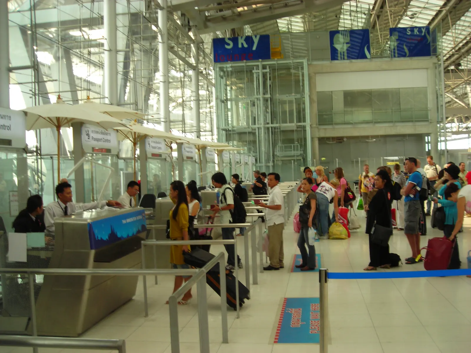 Passport control counters in the arrivals hall at Suvarnabhumi Airport, Bangkok