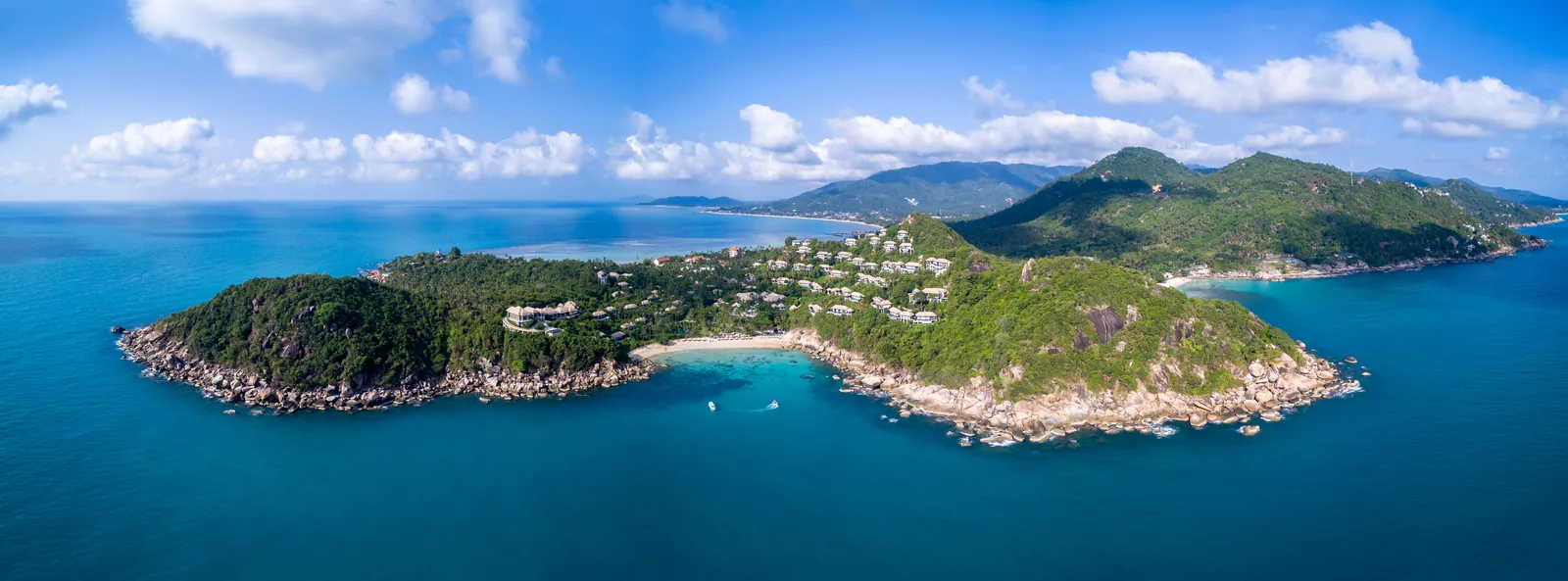 Aerial view of Banyan Tree Samui villas on a jungle headland above a private bay at the south-eastern tip of Koh Samui